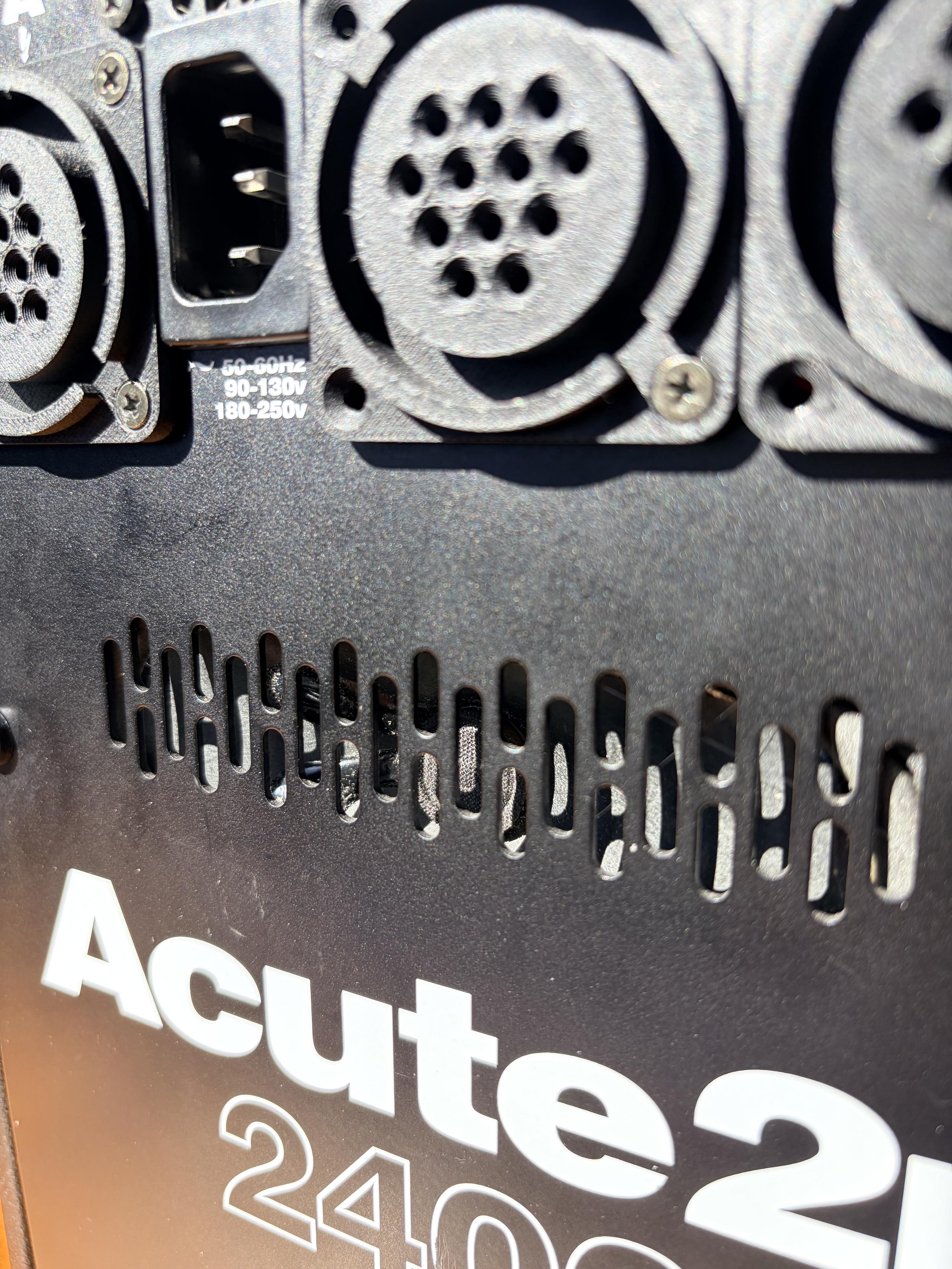 A close up of a ventilation grill on the pack, you can just make out the speaker behind it